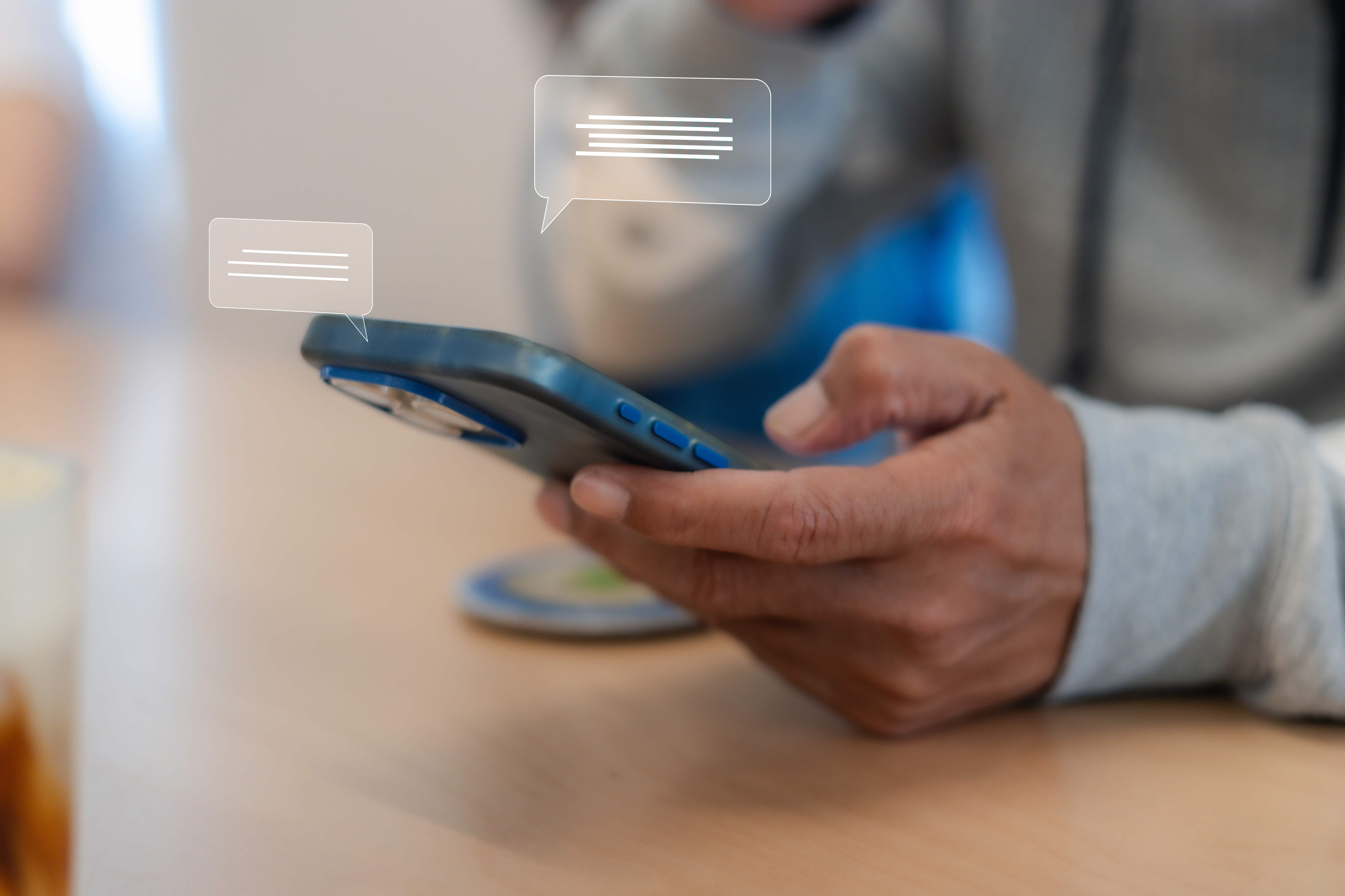 Close up man using smart phone, Social media marketing concept. hand using smartphone typing, chatting conversation in chat box icons pop up